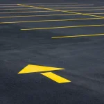 Asphalt Repair Kansas City - Kansas Asphalt pavement markings and line striping services in empty asphalt parking lot