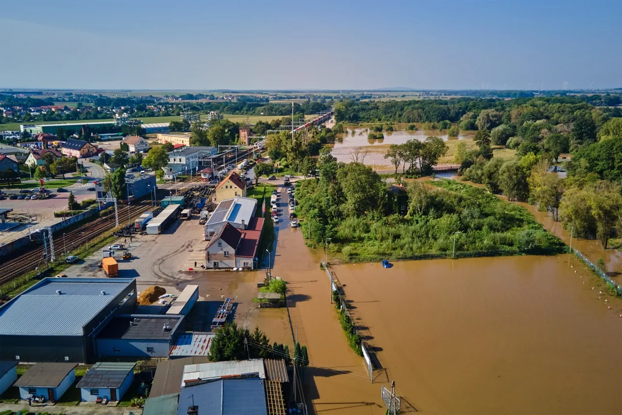 Flooded railway and industrial zone in small town