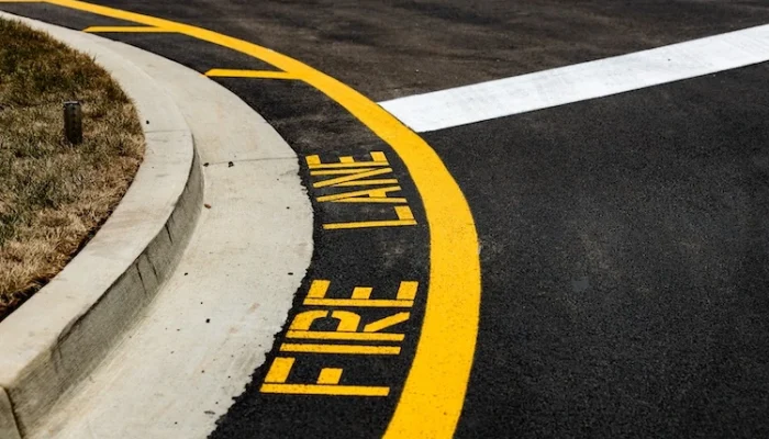 Fire Lane signage painted on pavement at elementary school